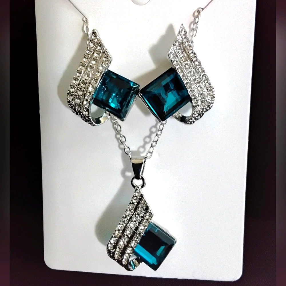 Zirconium and Sapphire pendent on a 8 inch chain with matching earrings.